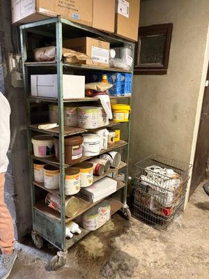 a man standing in front of a shelf of food