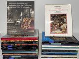 several books are stacked on top of each other on a table