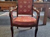 a chair that is sitting in the middle of a room