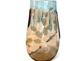 a glass vase with fish and plants in it