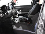 a picture of the inside of a car with a steering wheel