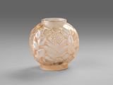 a glass vase that has a flower design on it