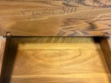 a close up of a wooden bench with writing on it