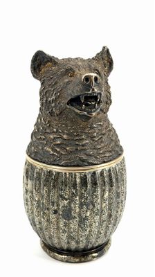 a ceramic bear that is sitting in a vase
