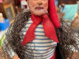 a figurine of a man with a beard and a red hat