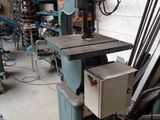 a machine that is sitting in a room with a lot of tools