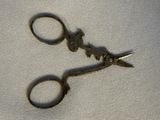 a pair of scissors that are on a cloth