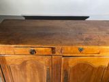 a wooden cabinet with two doors and two drawers