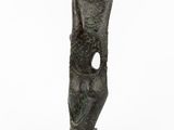 a bronze sculpture of a face with a hole in the middle
