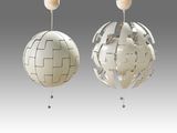 two white globe lamps hanging from a ceiling with a wooden base