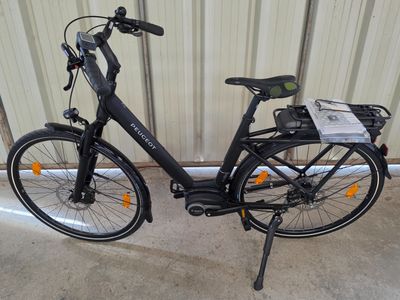 a bike that is parked in front of a building