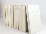 six books stacked on top of each other on a white surface