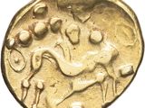 a close up of a gold coin with a horse on it