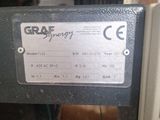 a label on a machine that says graf energy