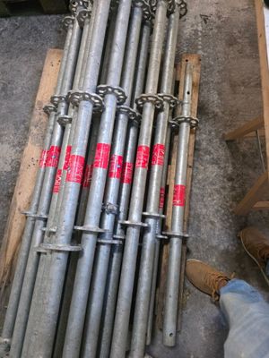 a pile of metal pipes sitting on a pallet
