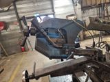 a machine that is working on a piece of metal