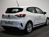 the rear end of a white car in a showroom