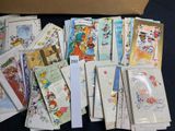 many cards and envelopes laid out on a table
