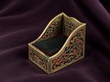 an image of a small wooden box on a purple cloth