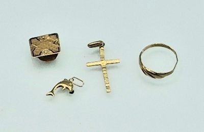 three rings, a cross, a ring, and a ring on a white surface