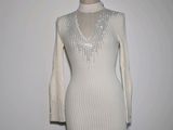 an image of a dress on a mannequin stand