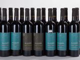 six bottles of red wine are lined up in a row