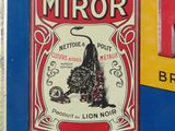 a tin of mirror with a picture of a cat on it