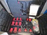 many tools in the case that are sitting on the floor