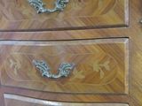 an image of a wooden dresser with a marble top
