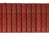 a row of red books sitting on top of each other