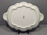 a white plate with a decorative design on it