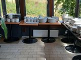many plates and bowls on the table in the room