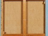 a picture of a wooden bookcase with a cat sitting on it