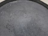 a large metal pan sitting on a counter top