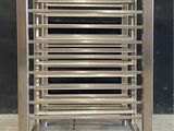 a metal rack that has a bunch of shelves on it