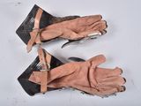 two pairs of gloves that are sitting on a table