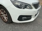a picture of a white car parked on the side of the road