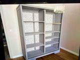 a picture of a tv screen with a picture of a bookcase