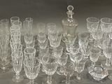 a lot of glasses that are sitting on a table