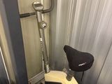 a suitcase and a suitcase bag sitting next to a scooter in a storage room