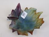 a blue and green leaf shaped bowl with a tag on it