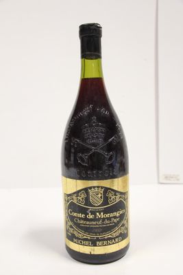 bottle of wine on a white table with a white background