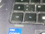 a close up of a laptop keyboard with a sticker on it