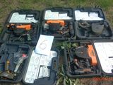 many different types of tools in a case on the ground