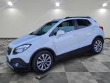 a white buick suv is parked in a large room