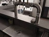 a picture of a kitchen with a sink and a faucet