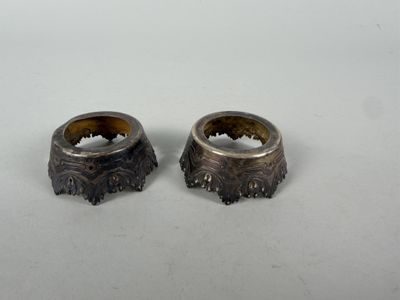 two rings sitting on top of each other on a table