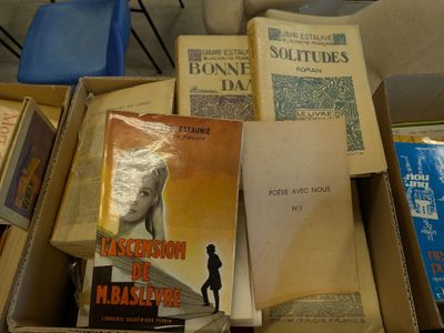 boxes of books are stacked on top of each other on a table