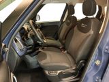 the interior of a small car with two seats and a steering wheel