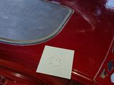 a red toy car with a number on it